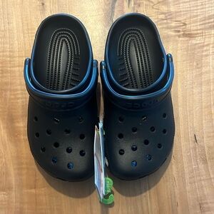 Black crocs classic. Womens 6/Mens 4. Brand new with tags and bag.
